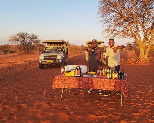 Sundowner drinks in the Kalahari, Namibia’s Red Desert Magic Namibia’s Kalahari Desert—home to red dunes, unique wildlife, and ancient cultures in one of Africa’s most serene and striking landscapes.