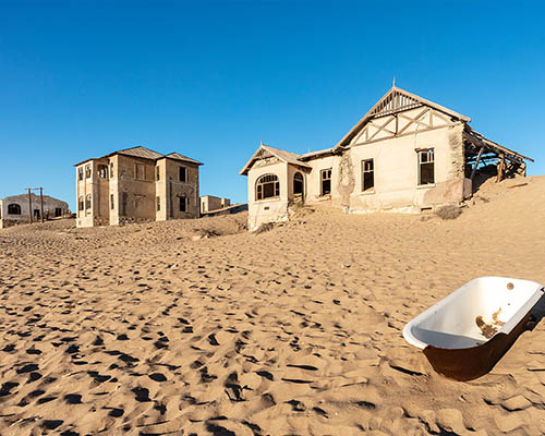 Discover Lüderitz and Historic Kolmanskop visit the coastal town of Lüderitz and wander through Kolmanskop, a desert ghost town frozen in time and filled with stories