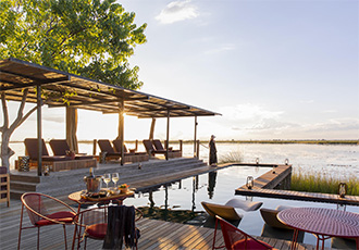 Spend time relaxing next to the swimming pool Okavango Delta Fly-In Safari Botswana