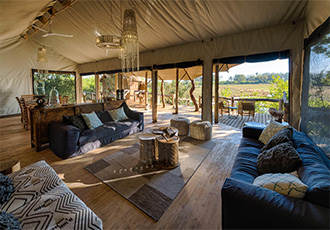 Relax in the public lounge at Little Tubu Okavango Delta Fly-In Safari