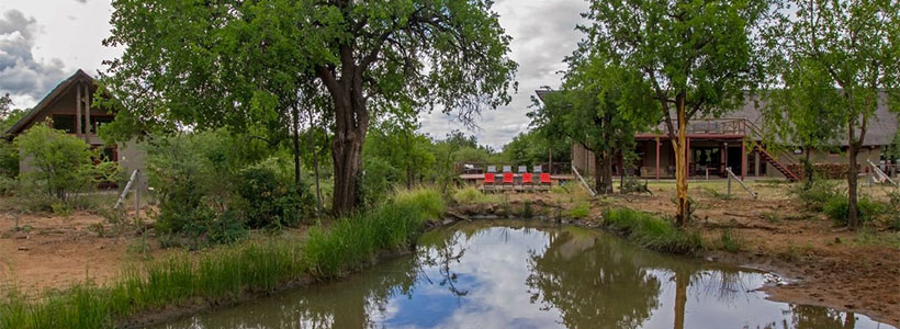 Pilanesberg Private Lodge, viewd from the waterhole Pilanesberg Private Lodge, situated in the Black Rhino Game reserve in Pilanesberg